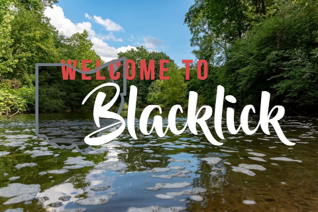 A river with the words welcome to blacklick on it