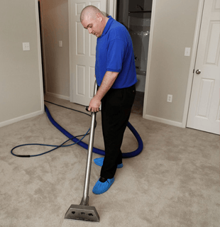 Air Quality Testing — Man Doing Vacuum on the Floor in Brandon, MS