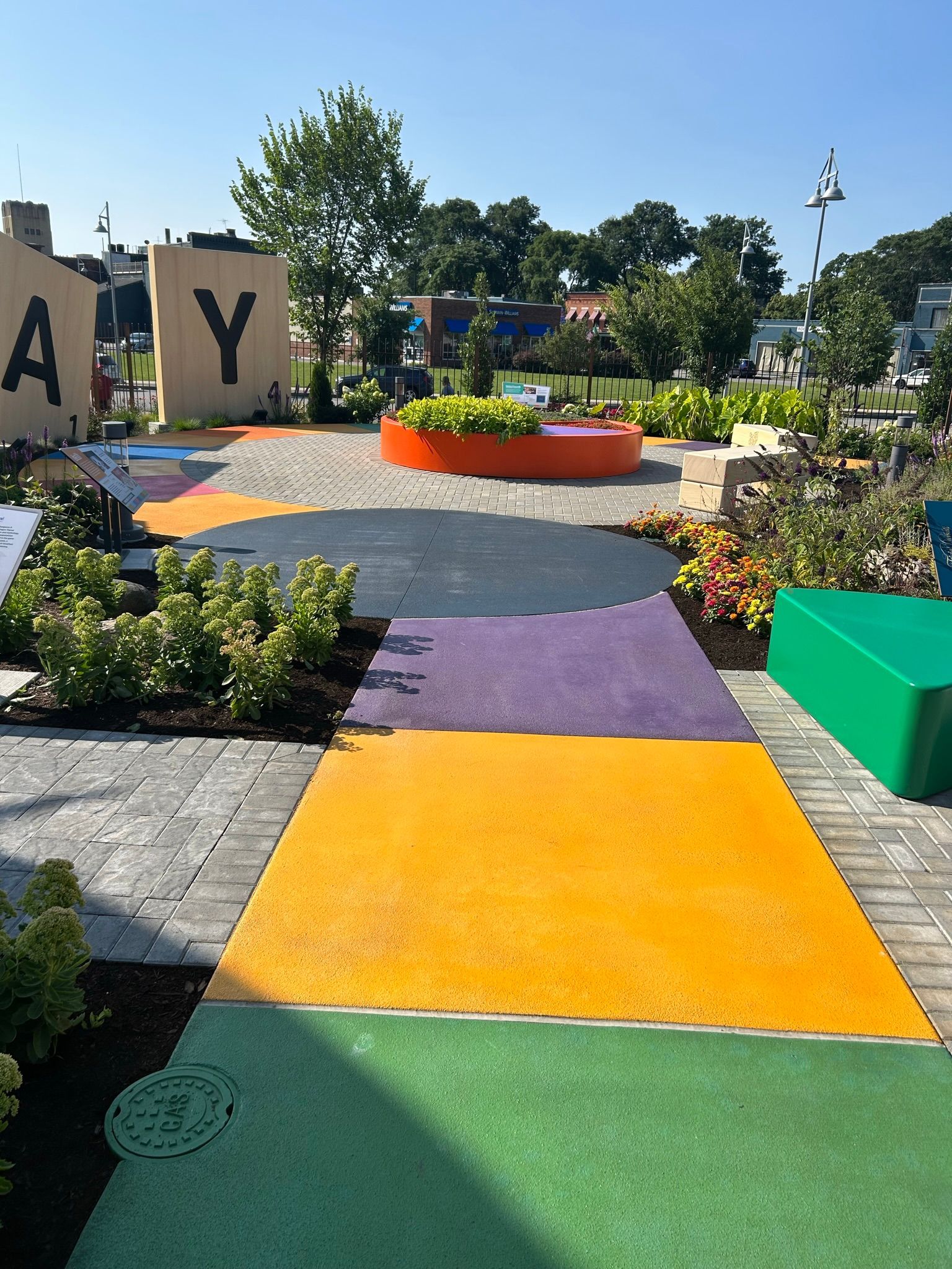 A park with a sign that says ay on it