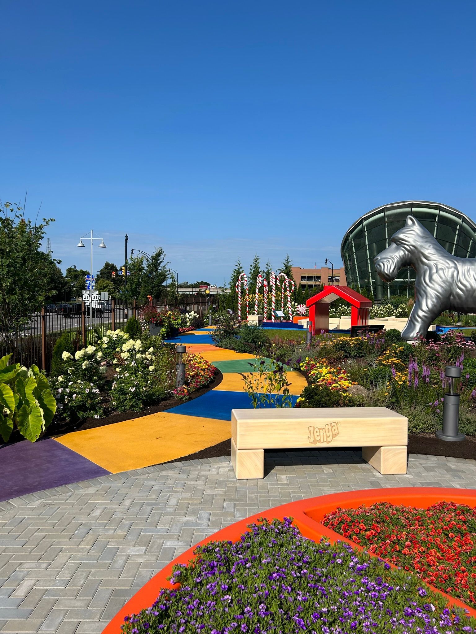There is a statue of a horse in the middle of a garden.