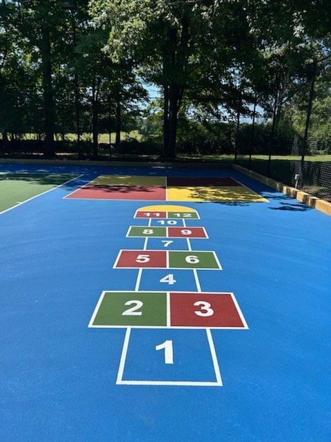 A playground with a hopscotch pattern painted on it
