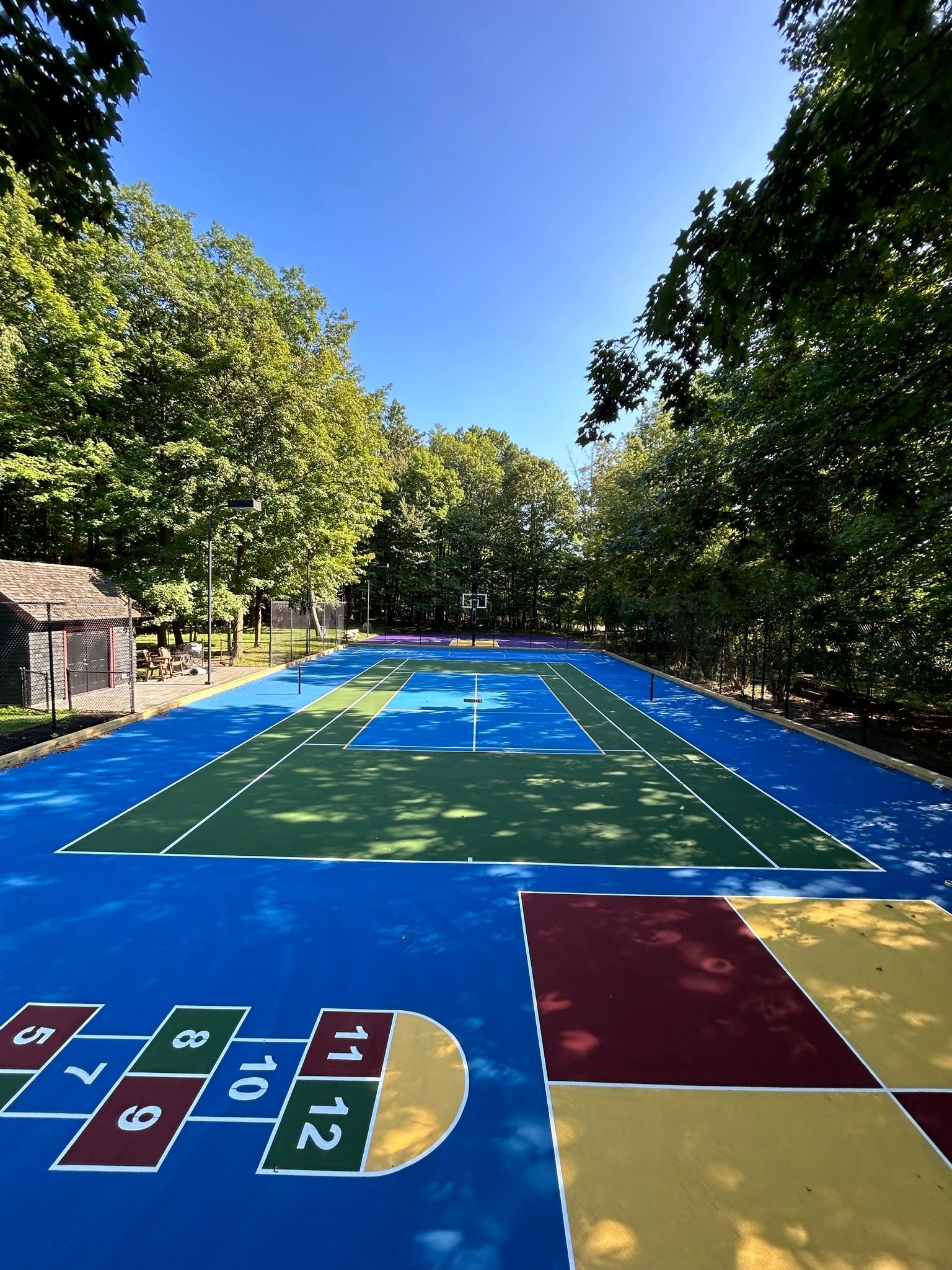 A basketball court with a hopscotch game painted on it