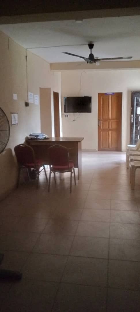 There is a ceiling fan in the middle of the room.