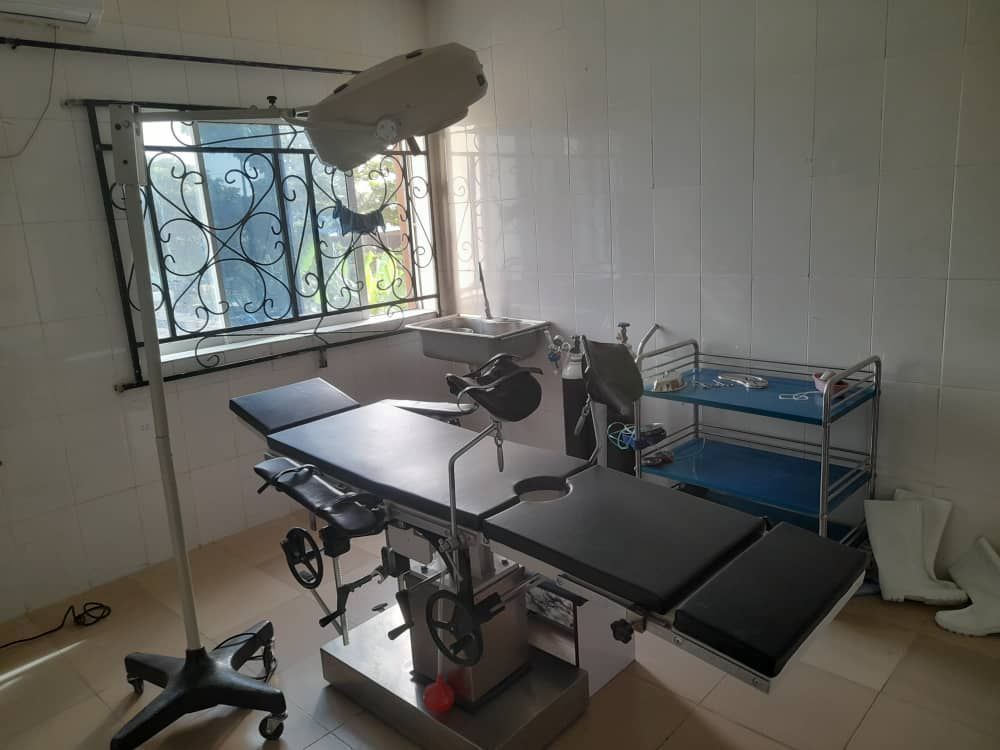 An operating room with an operating table and a window.