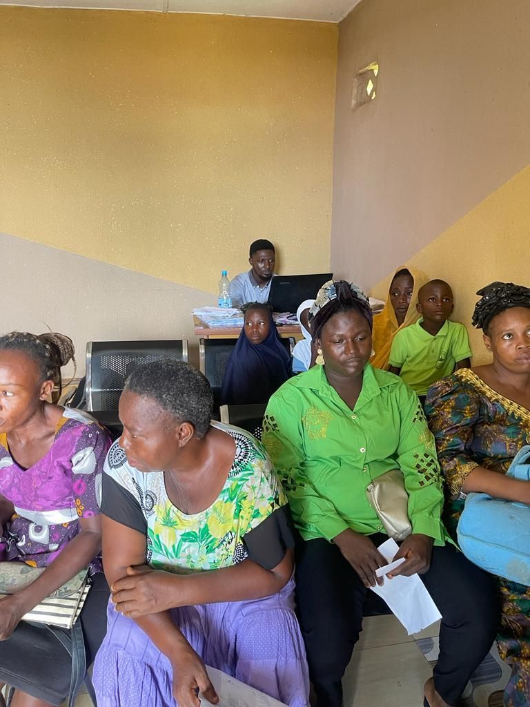 A group of people are sitting in a room.