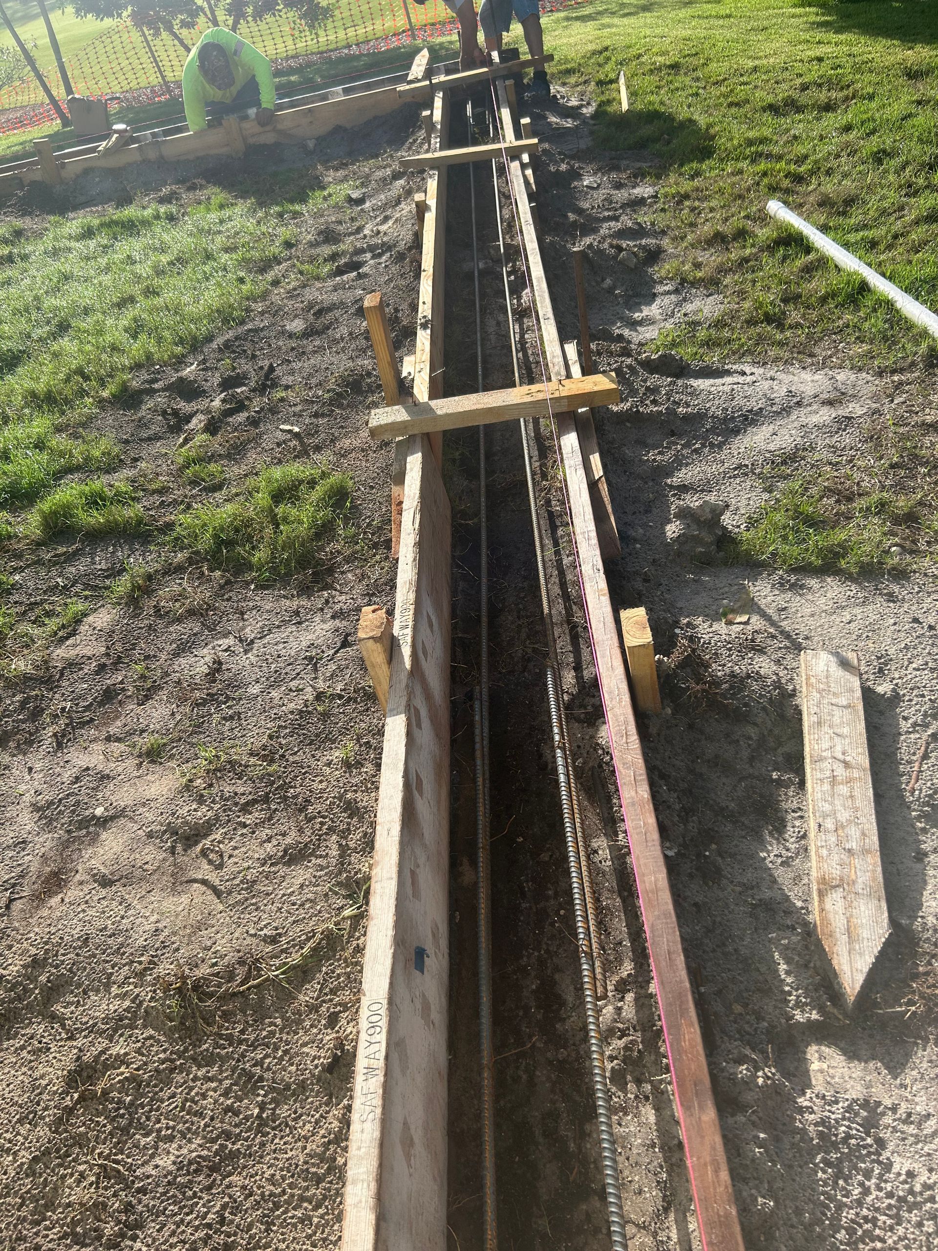 Wooden forms set for concrete pouring; a construction site.