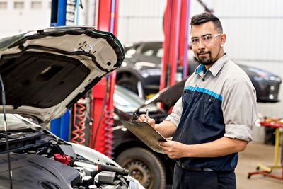 Mechanic  Doing A Car Inspection  — Dundee, IL — Dundee Collision Inc.