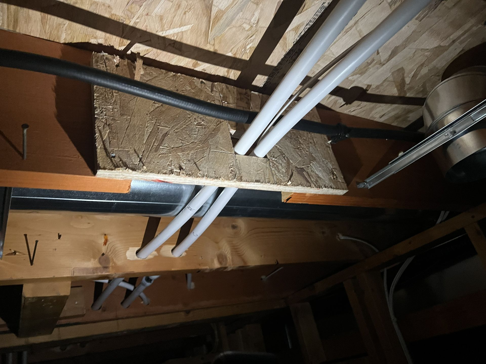 Overhead view of a house with a gray shingle roof.