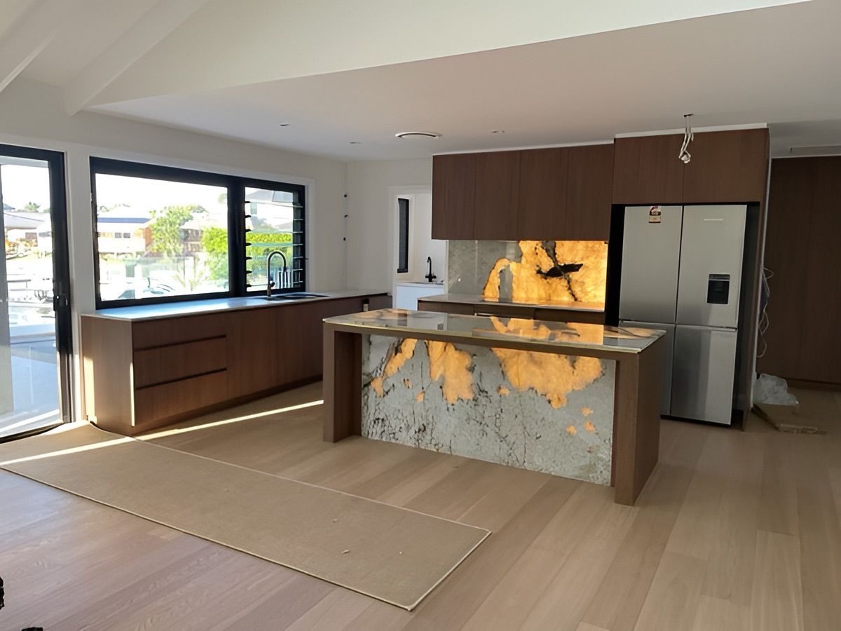 A Kitchen With A Marble Counter Top And A Refrigerator — D & L Custom Cabinets  In South Murwillumbah, NSW 