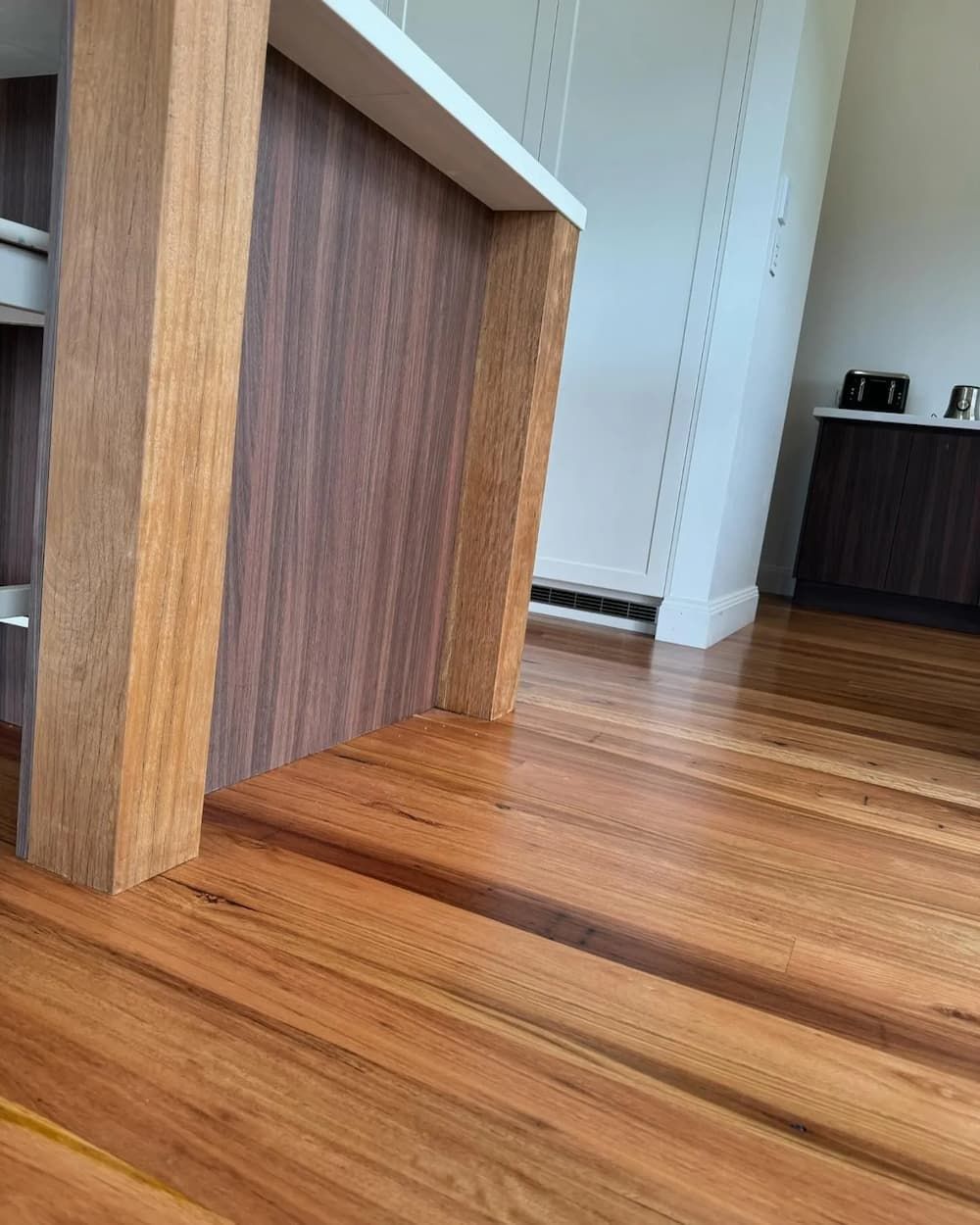 A Close Up Of A Wooden Floor In A Kitchen — D & L Custom Cabinets  In South Murwillumbah, NSW 