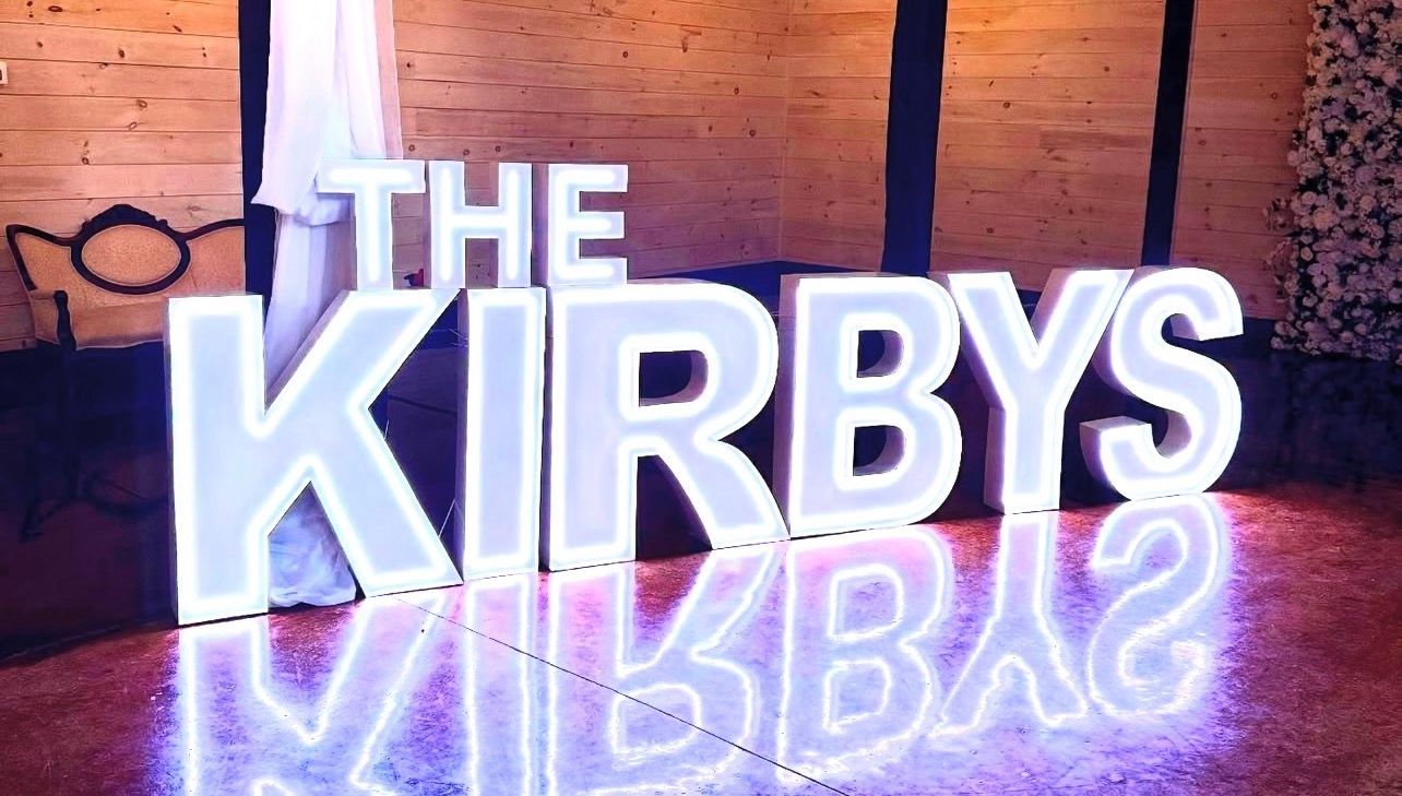 Large illuminated letters spelling 