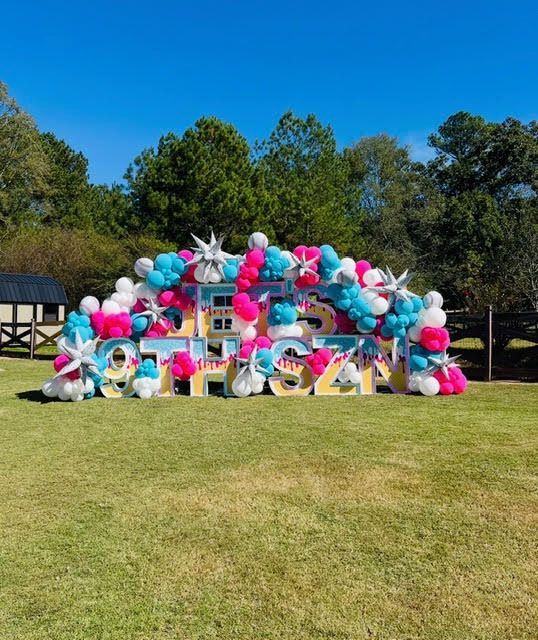 Large sign on grass spelling 
