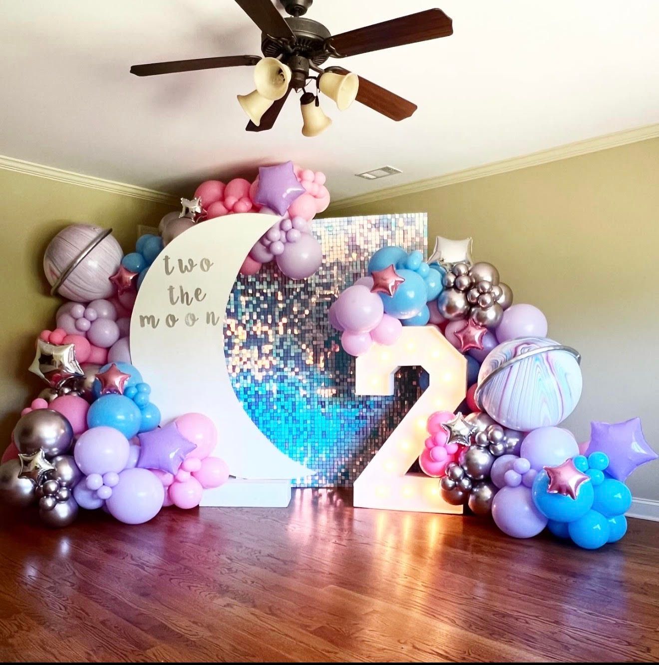 Birthday party backdrop with moon, number 