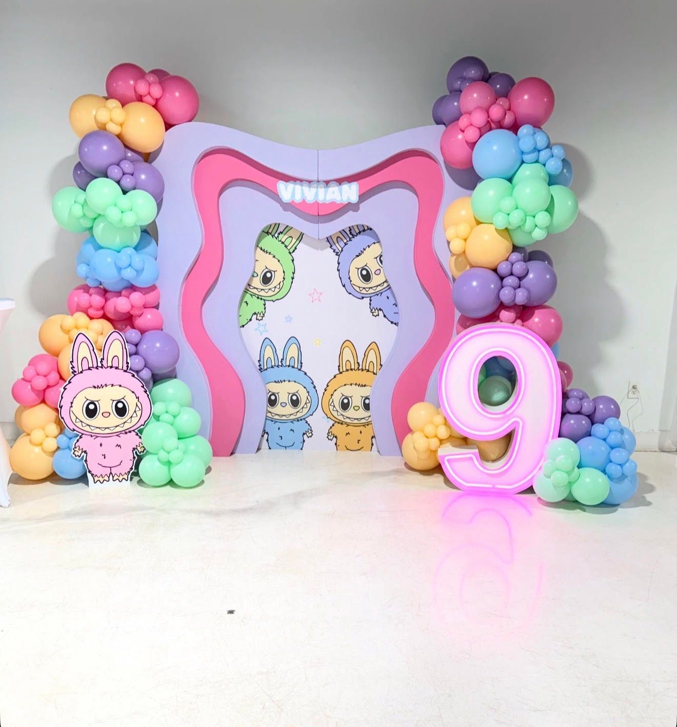 A purple event backdrop with 