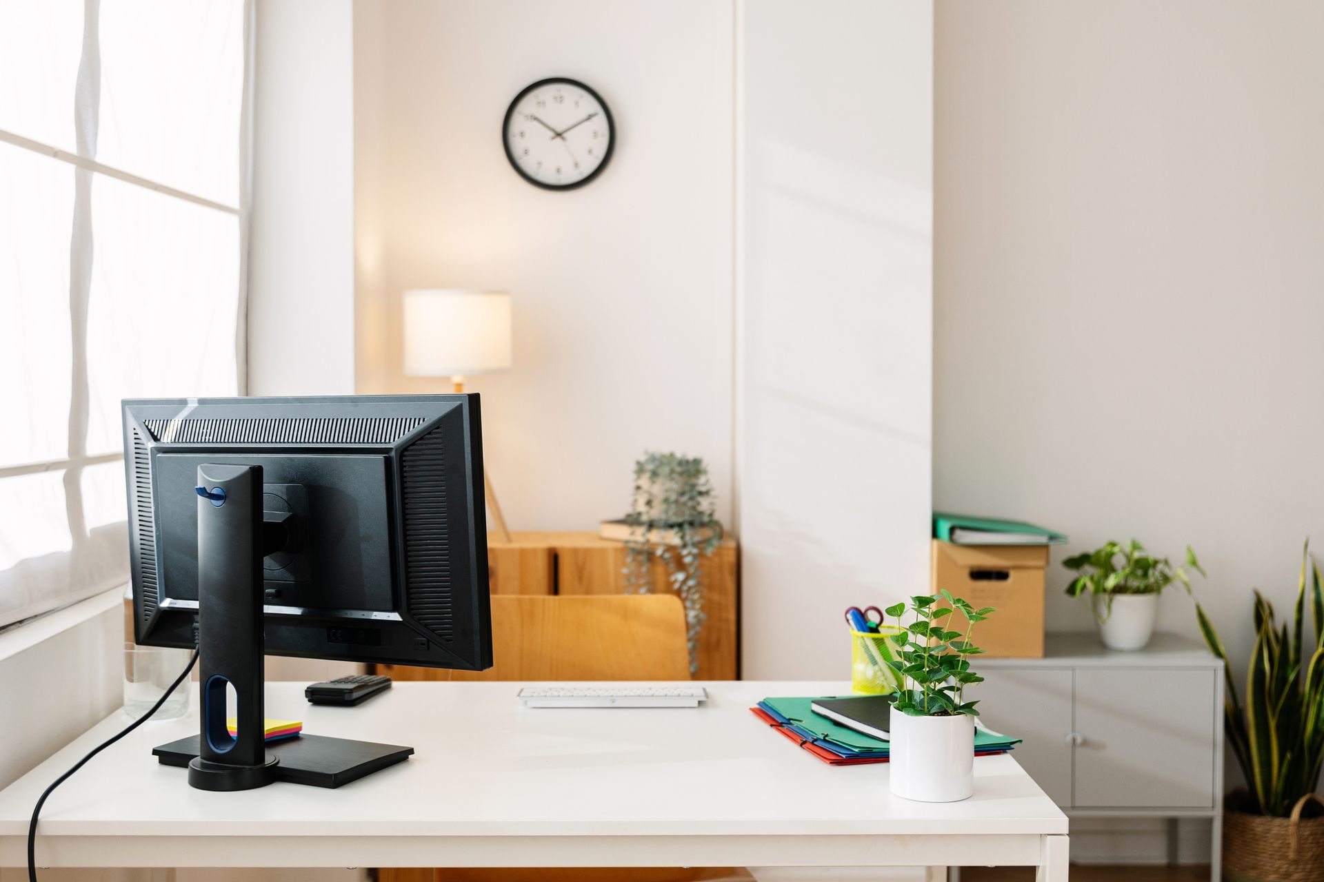 Small office workplace at bright apartment.