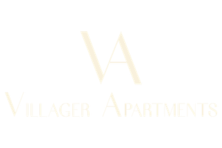 Logo for Villager Apartments featuring the letters "VA" above the full text in a minimalist, beige serif font.