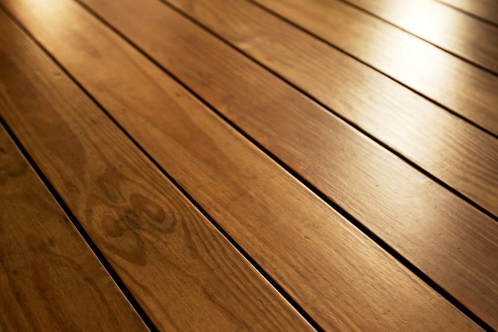 A Close Up of a Wooden Floor With a Few Lines — Freedom Flooring Pty Ltd in New Lambton, NSW