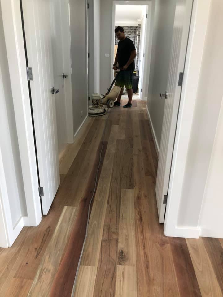 Worker Polishing Timber Flooring — Freedom Flooring Pty Ltd in Budgewoi, NSW