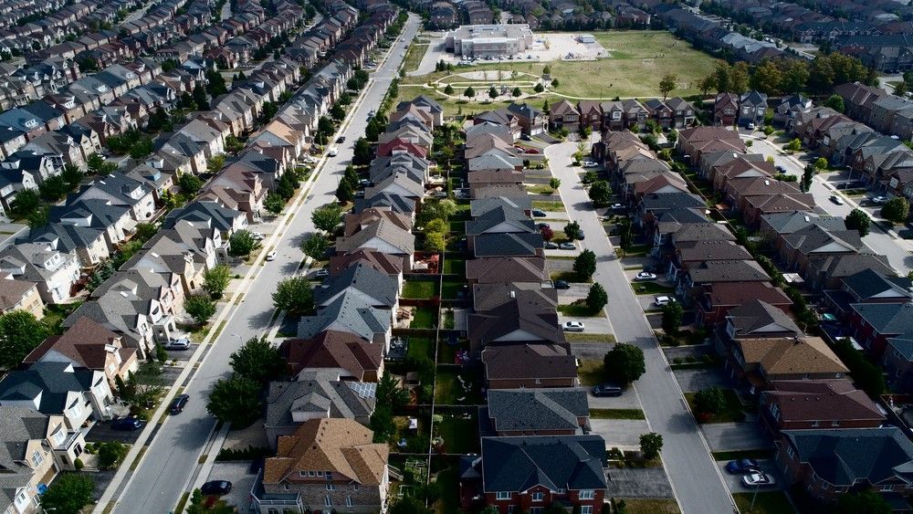 Aerial View of a Residential Area With Lots of Houses and a Park in the Background — Freedom Flooring Pty Ltd in Toronto, NSW