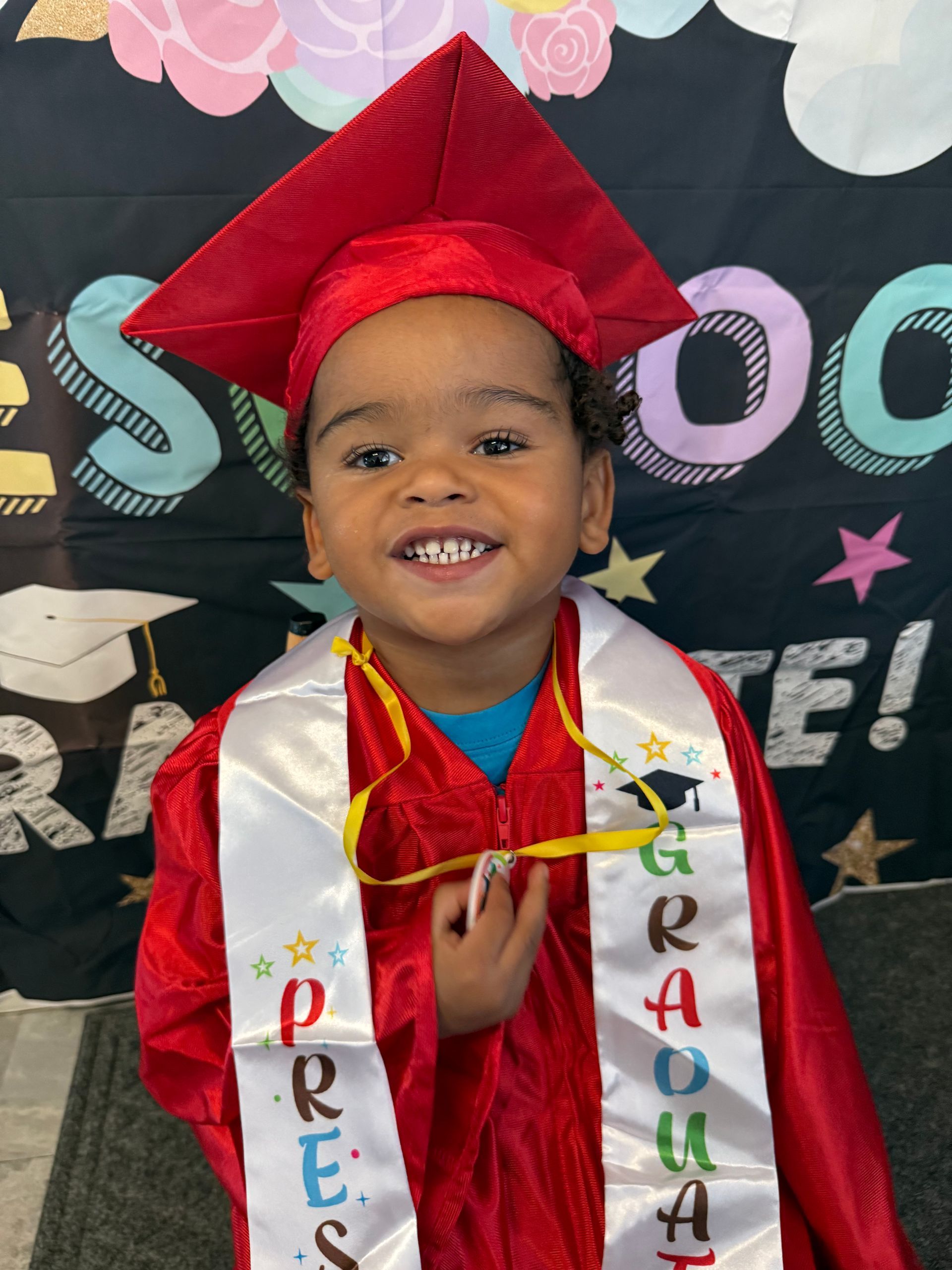 A woman is holding a little girl in her arms in a circle.