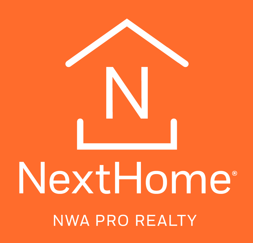 Logo for NextHome NWA Pro Realty featuring a white house icon with a large letter N on a bright orange background.