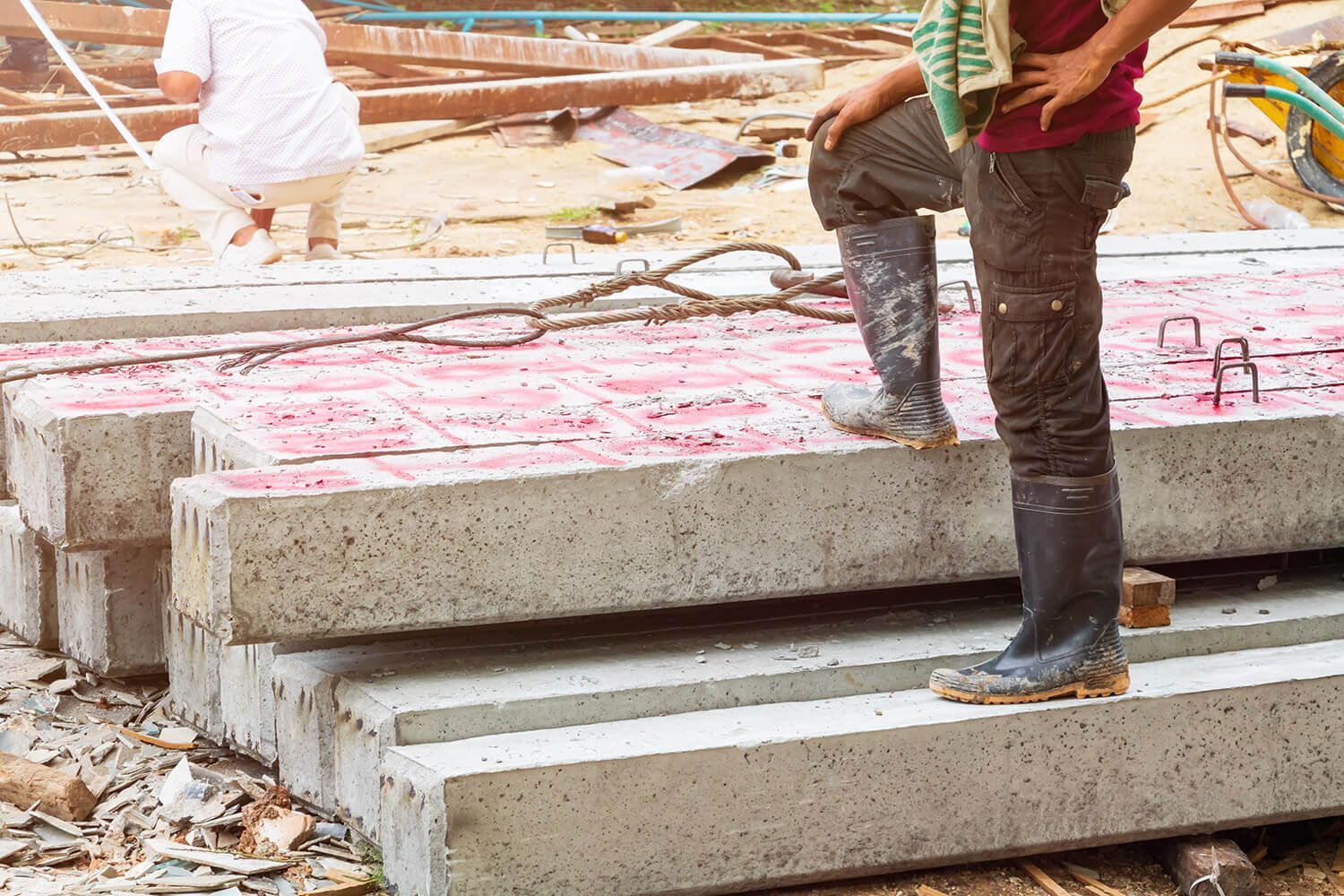 a man standing on some concrete steps in the middle of a construction site