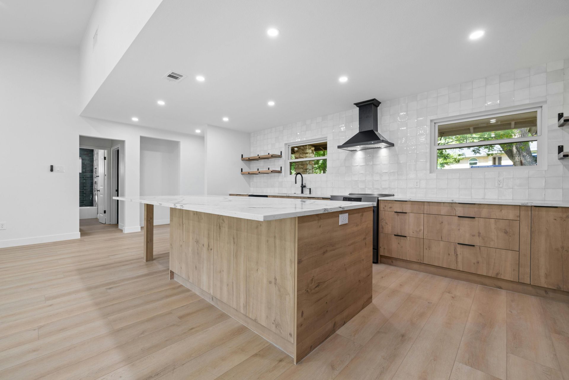 There is a large island in the middle of the kitchen.