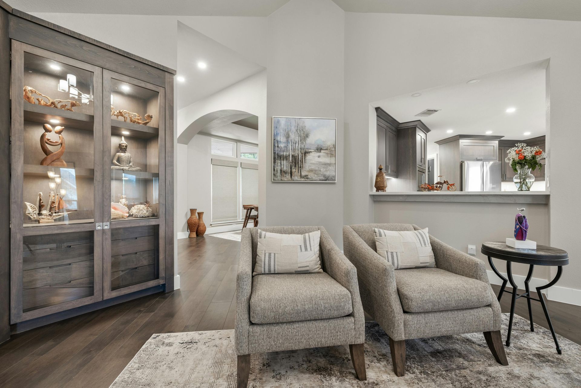 A living room with two chairs and a table.