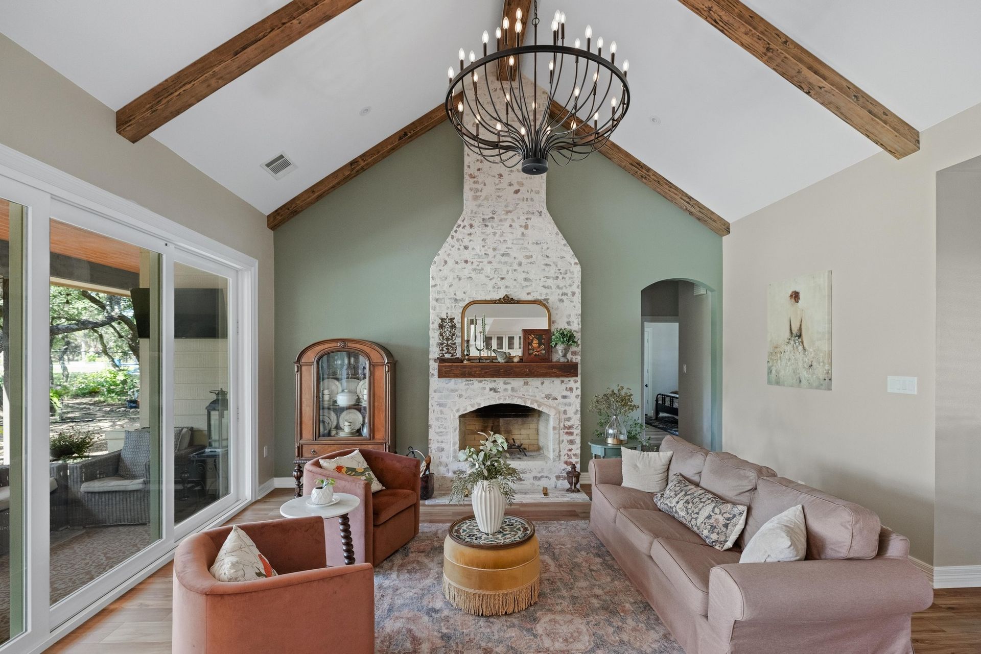 Sage green living room and German schmear fireplace