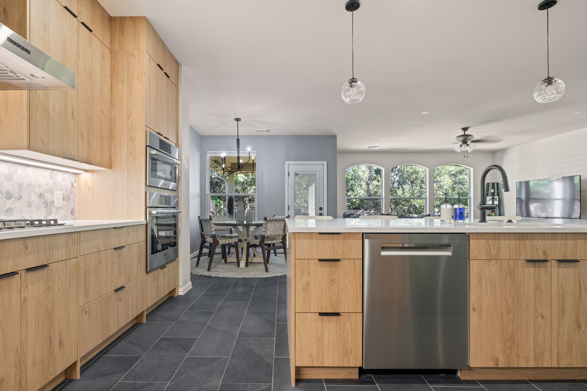 Kitchen with oak cabinets and slate flooring