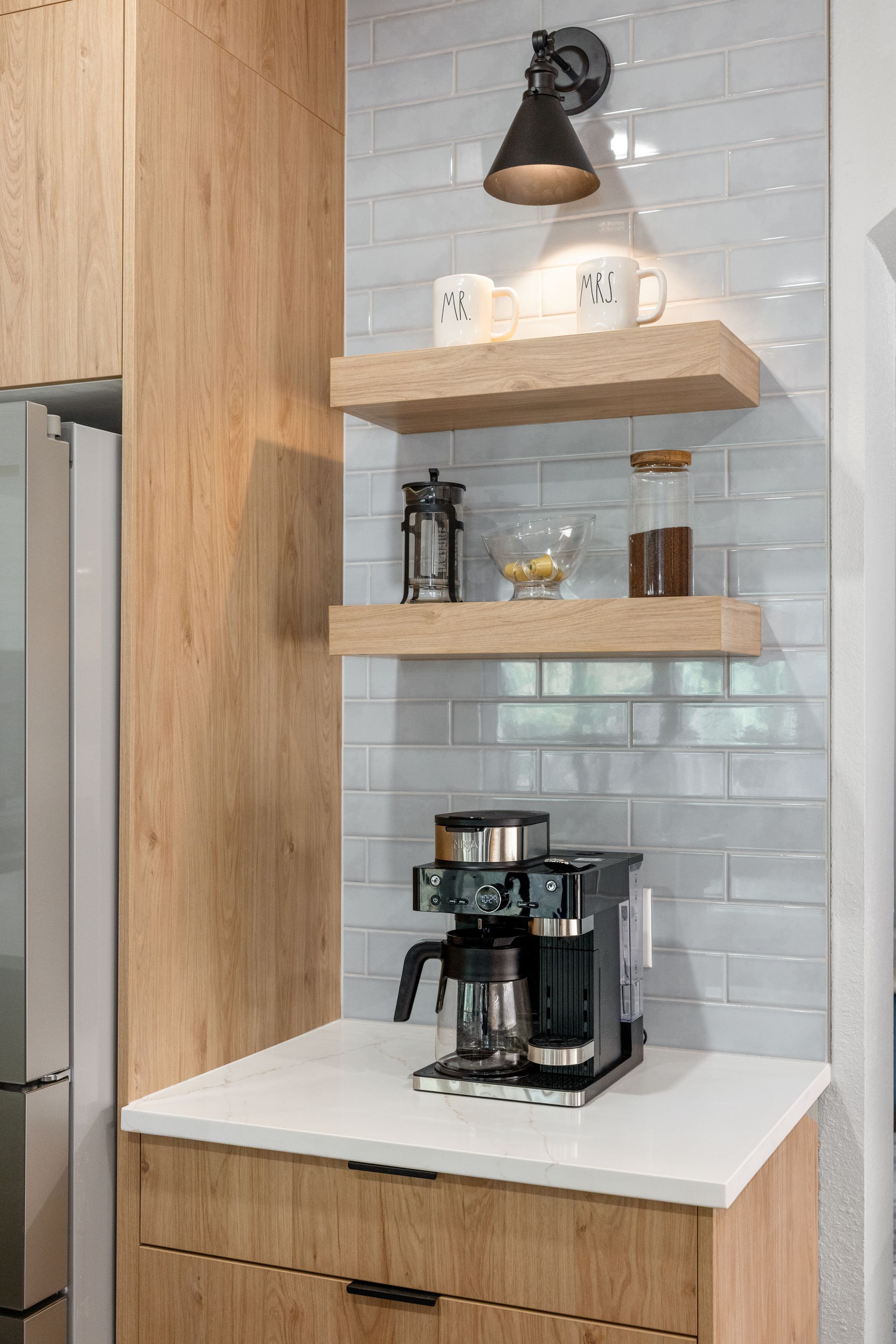 Coffee station with oak shelves and light blue tile