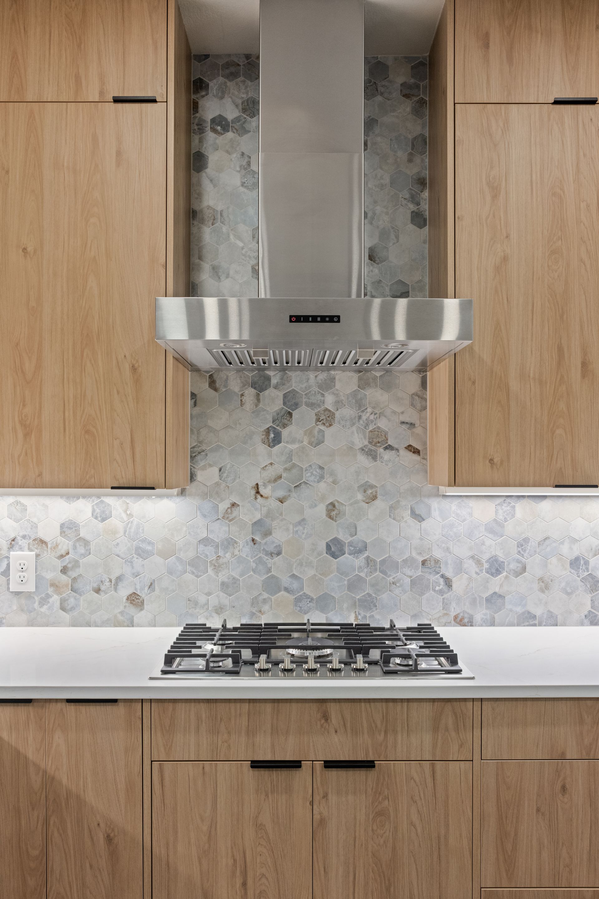 oak cabinets and nickel hood