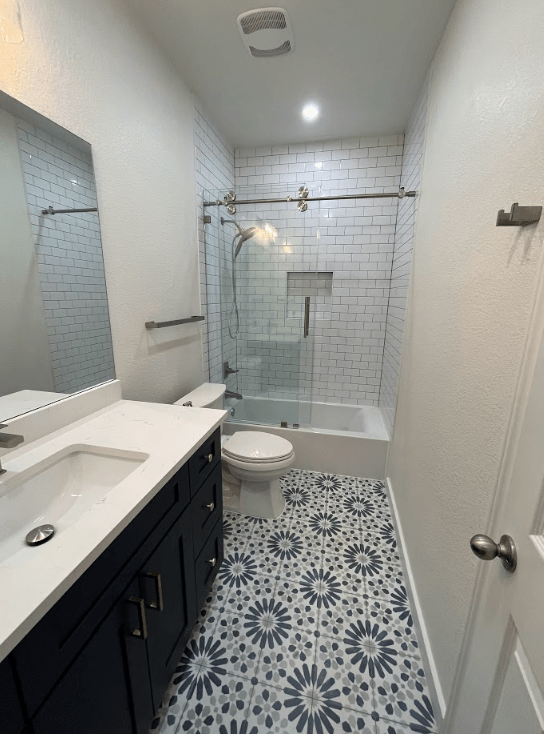 A bathroom with a sink , toilet and bathtub