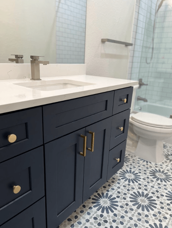 A bathroom with a sink , toilet , and shower.