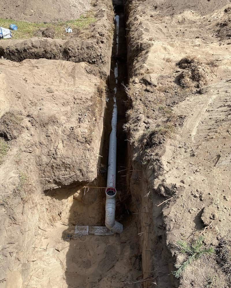 A Classroom With a Lot of Windows and a Black Table — CJM Plumbing & Roofing Mackay in Marian, QLD