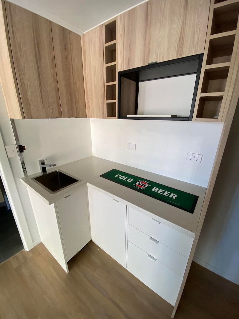 A Kitchen With a Sink and a Bar Mat on the Counter — CJM Plumbing & Roofing Mackay in Mackay, QLD