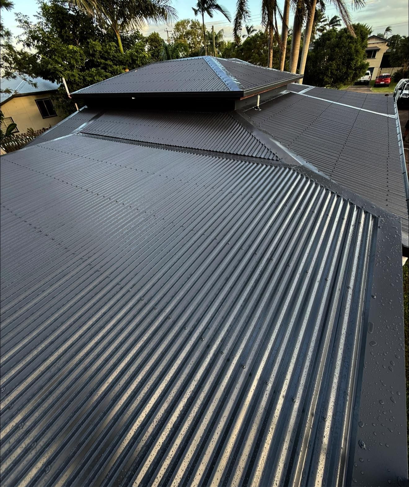 A Close Up of a Corrugated Metal Roof on a House — CJM Plumbing & Roofing Mackay in Mackay, QLD