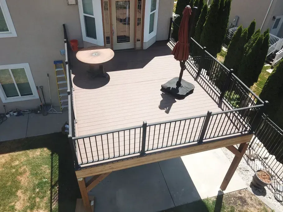 An aerial view of a deck with a table and umbrella.