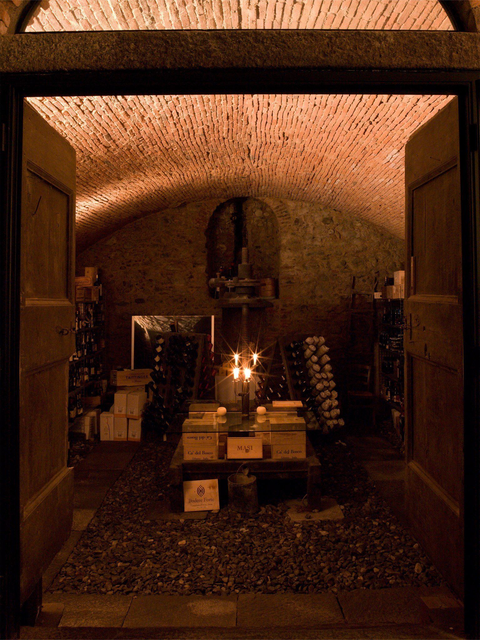 view inside a cellar with a table and candles
