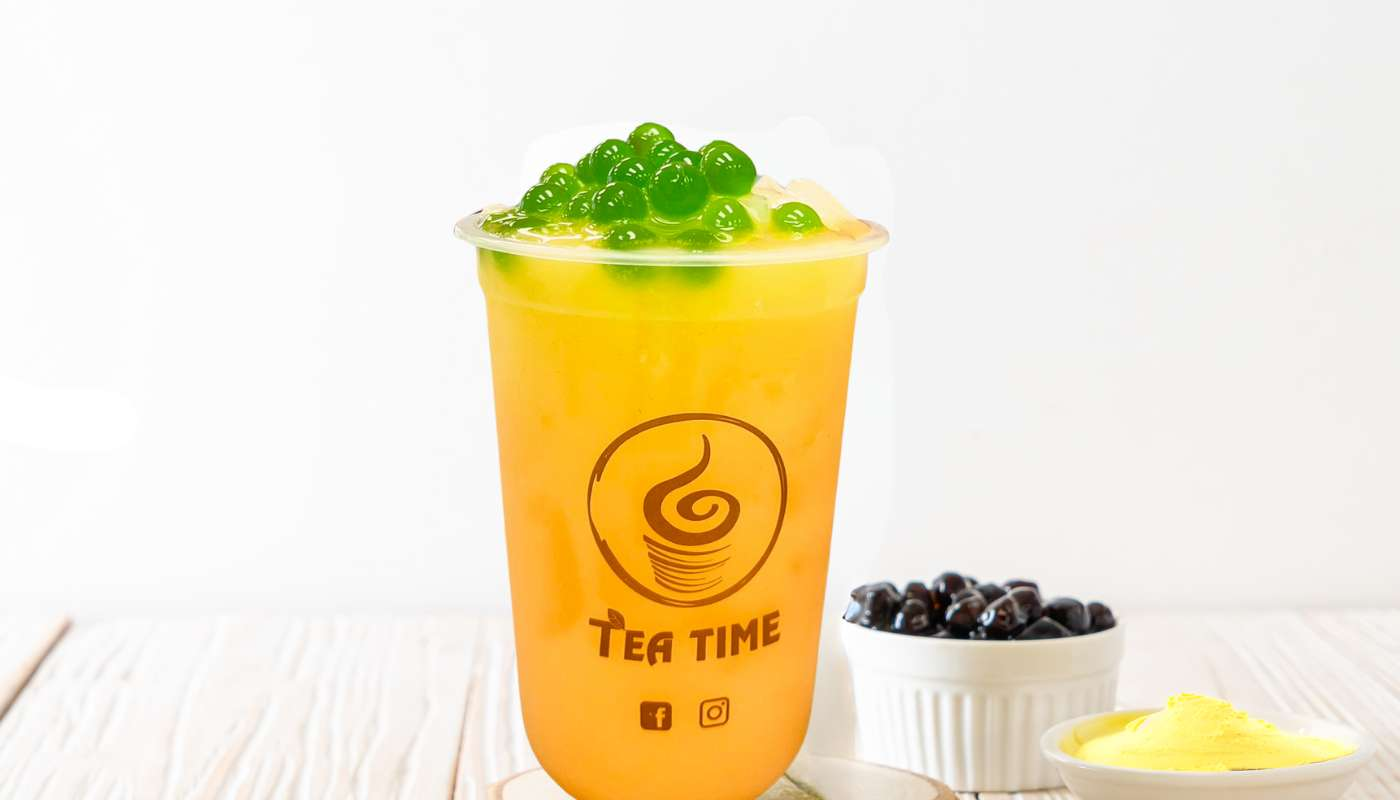 A close up of a cup of tea on a table.