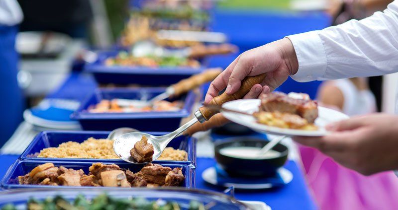 Business people group in the line catering buffet food
