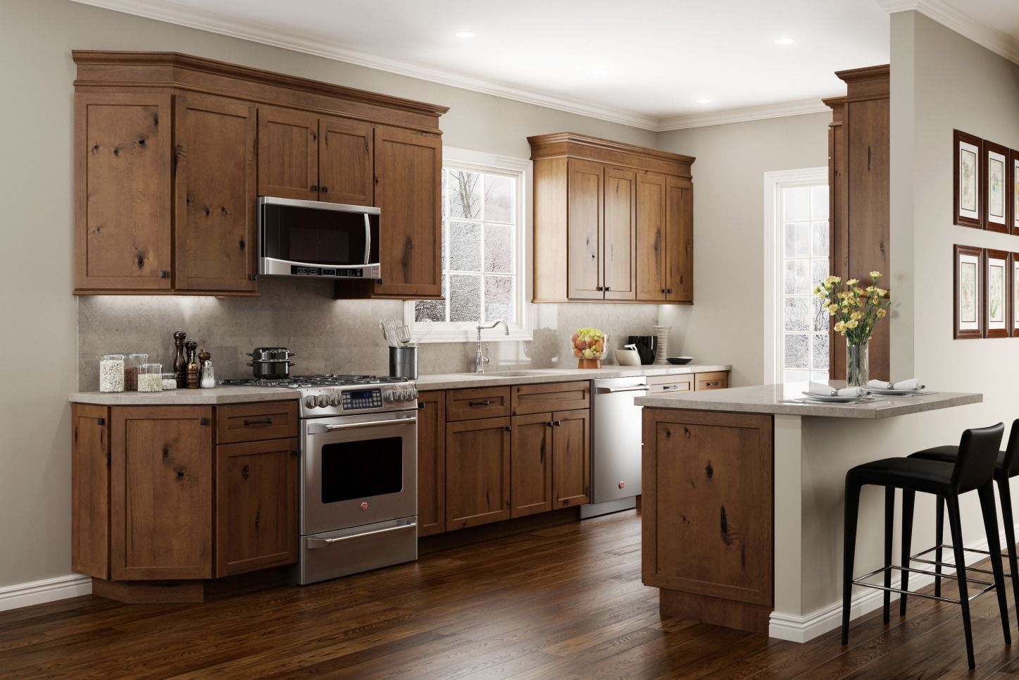 A modern kitchen with wood cabinets, stainless steel appliances, and a breakfast bar.