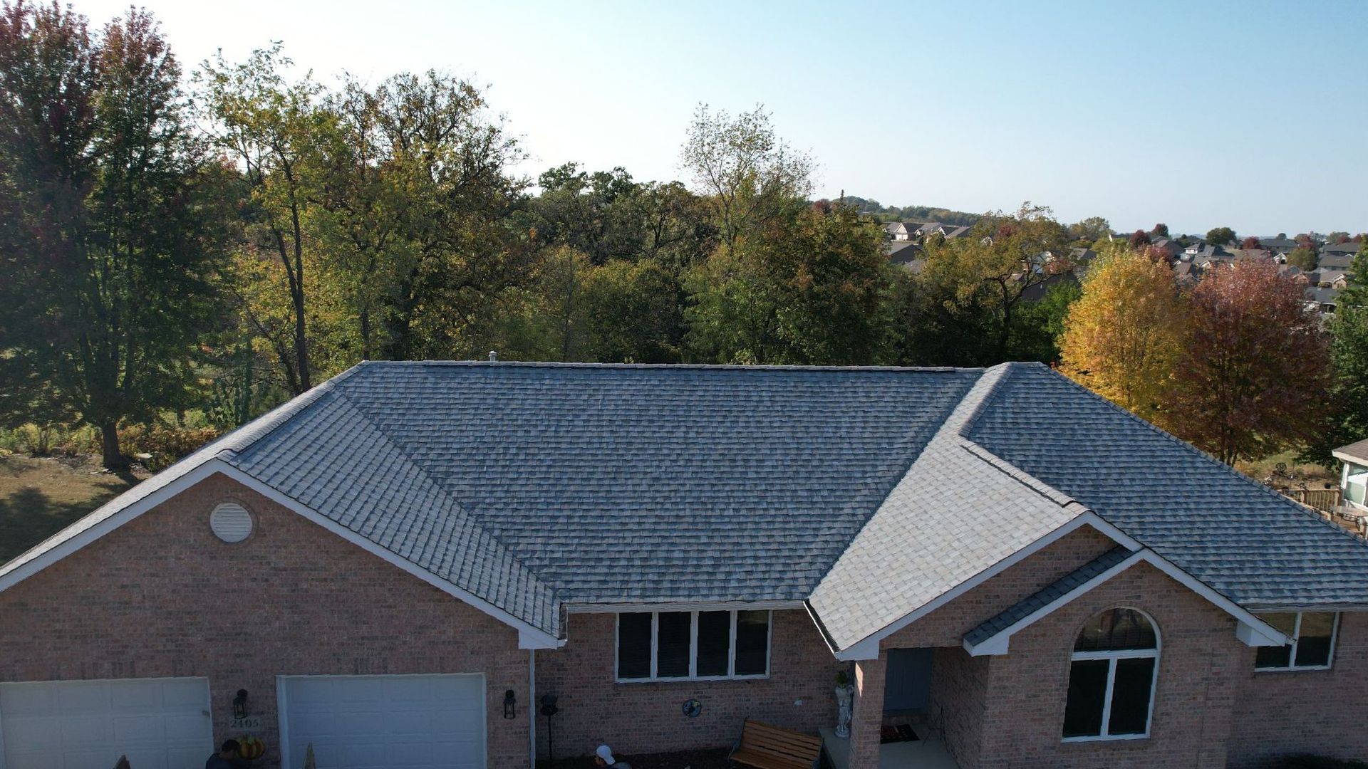 Completed grey roof with asphault shingles