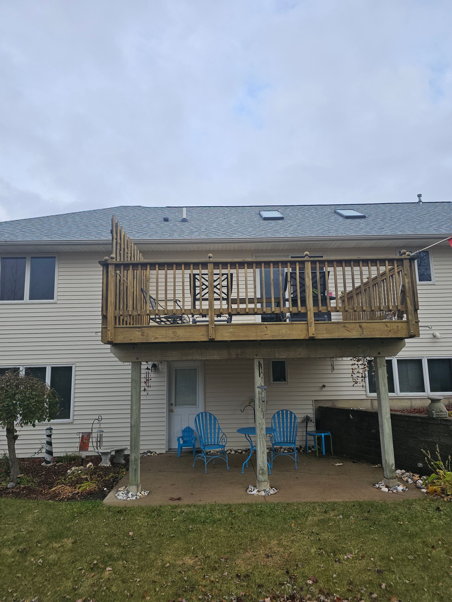 Original open deck with wood flooring and railing