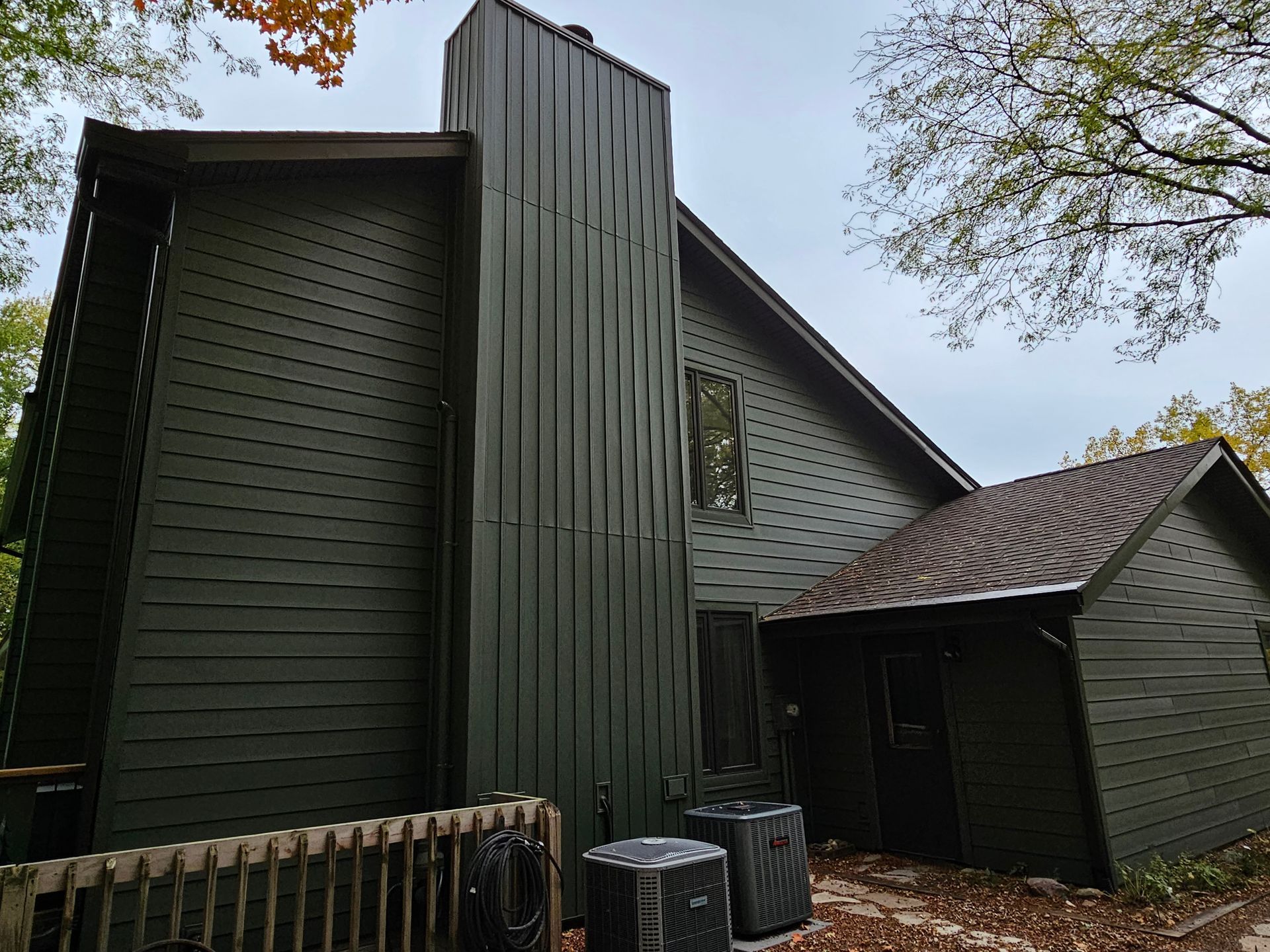 Green board and batten vertical siding in North Liberty Iowa