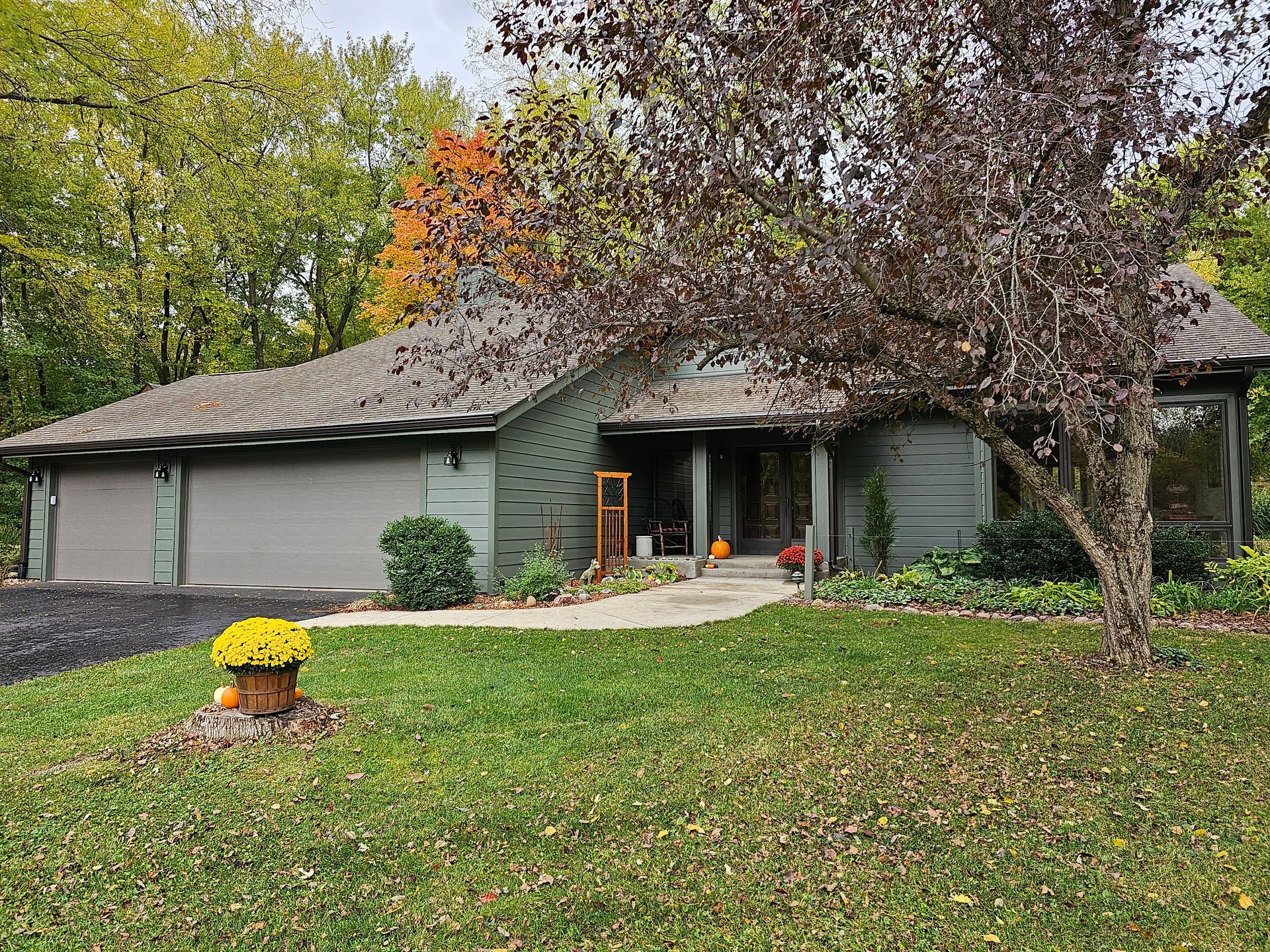 Green composite siding in North Liberty Iowa