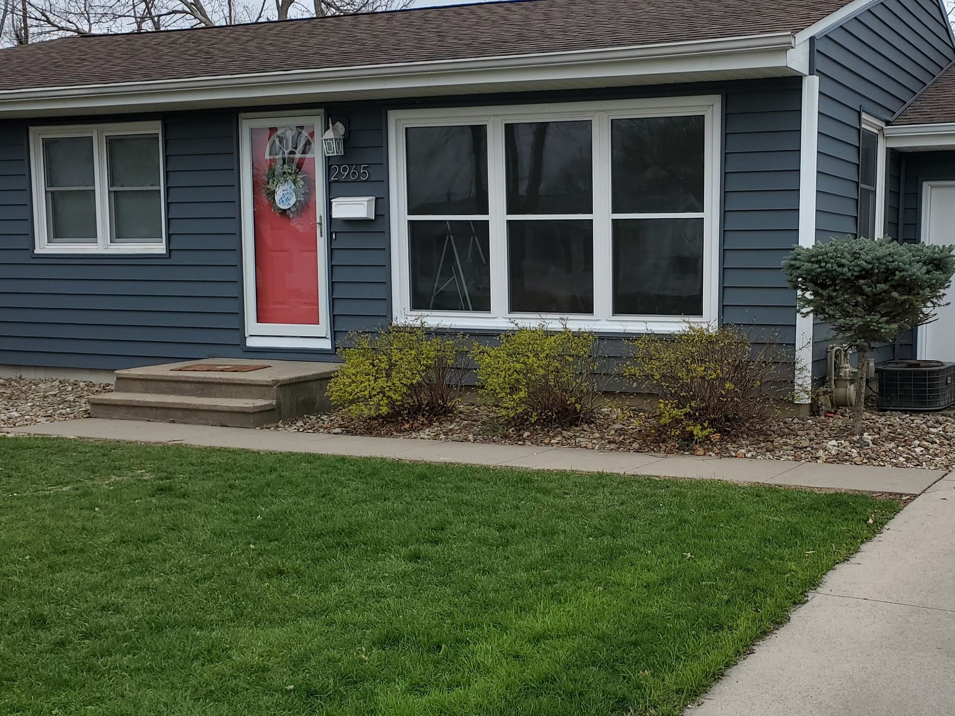 Blue insulated siding replacement in Marion Iowa