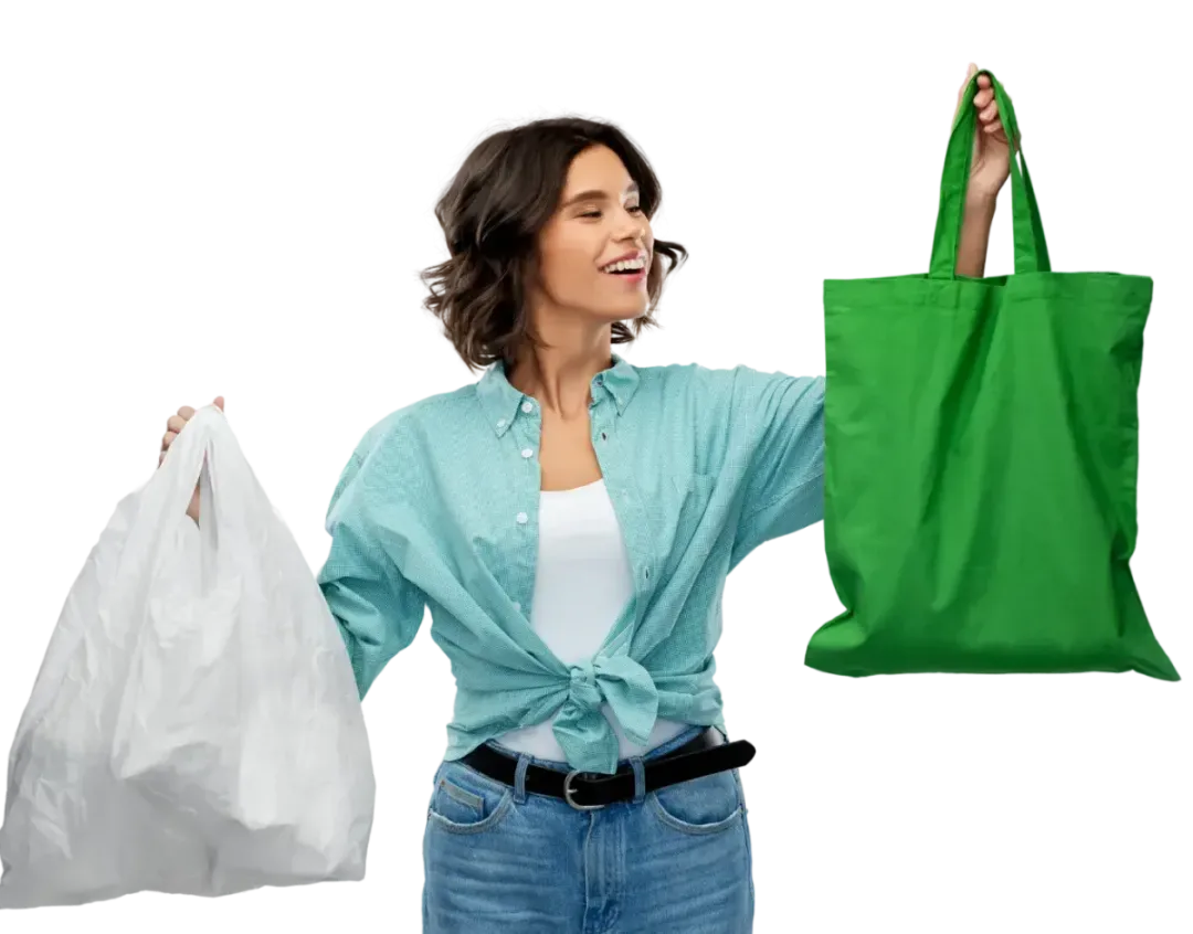 A woman is holding a green bag and a white bag.