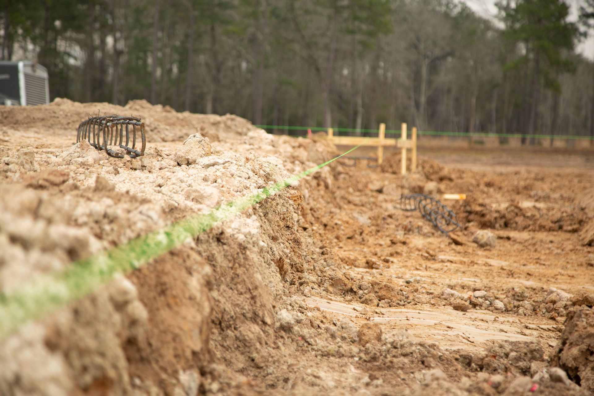 A pile of dirt is sitting on top of a dirt field.