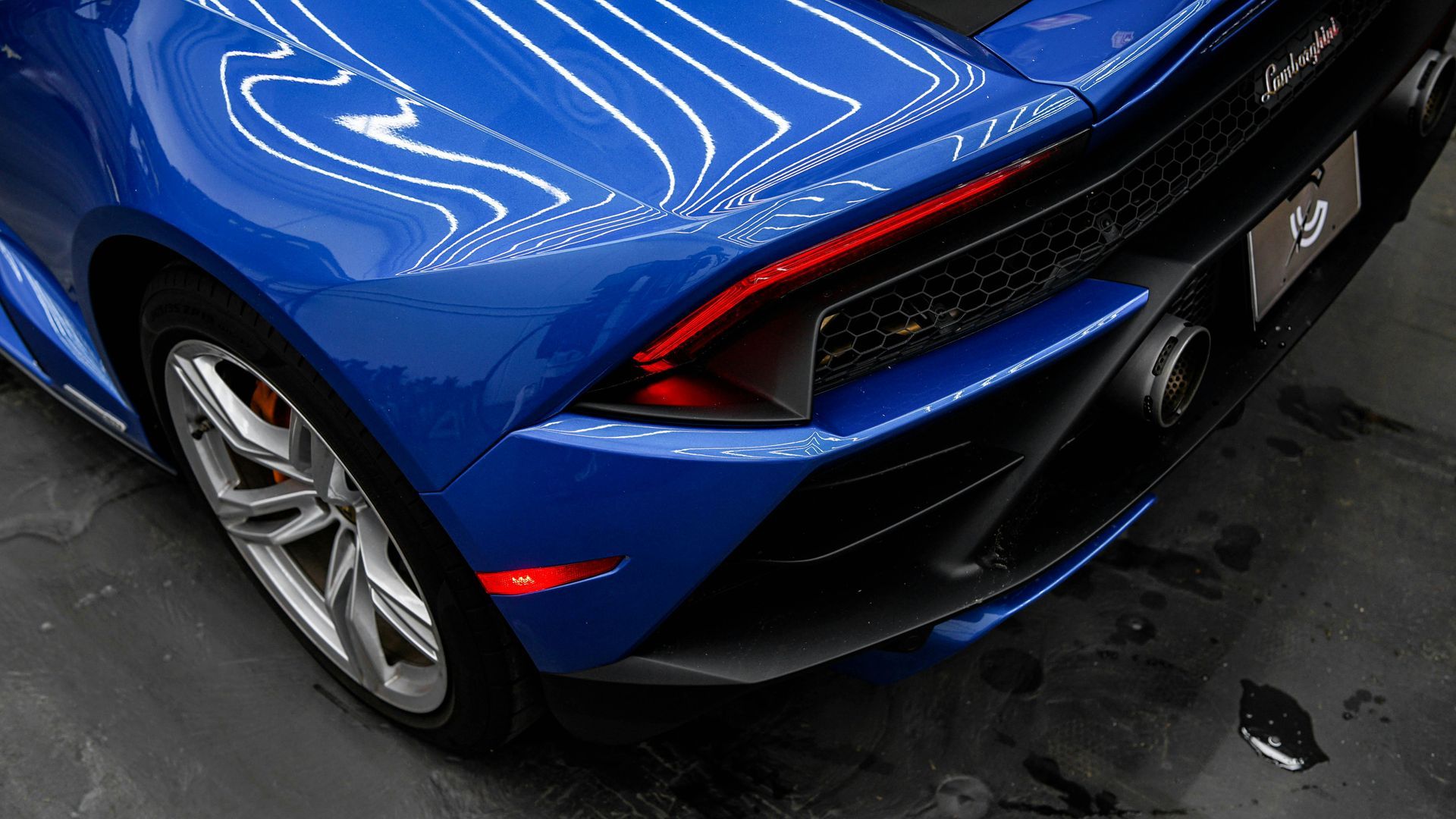 Professional ceramic coating service on luxury vehicle exterior